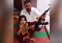 Pakistani father teaches little girl how to fire AK47